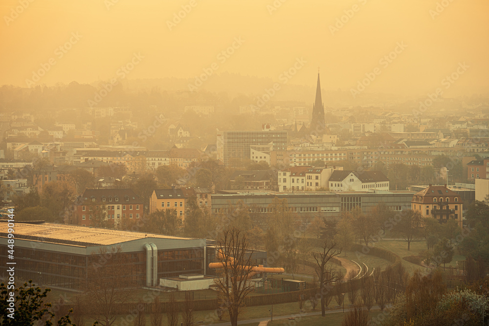 European city in the haze of morning fog