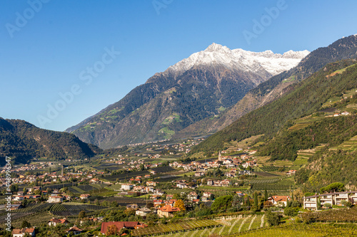 Panoramic view of Merano in Italy with mountains in background.