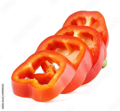 Pieces of red bell pepper close-up on a white background.
