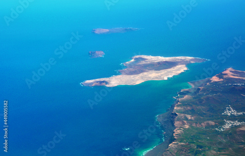 Photo taken by a plane of the island of La Graciosa, part of the island of Lanzarote and the Atlantic Ocean. Canary islands, Spain.