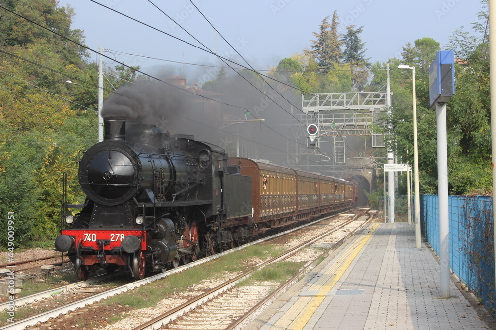 Fototapeta premium Beautiful steam train dedicated to John Cage, photographed on the Porrettana line, between Bologna and Pistoia