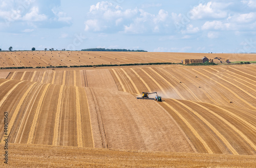 Crop havesting with combine on a dry sunny day