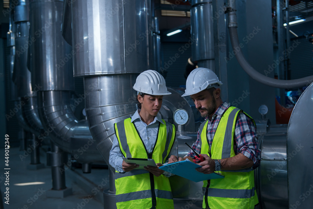 workers in plant. Two worker discuss in plant. workers in plant. Two worker discuss in plant.