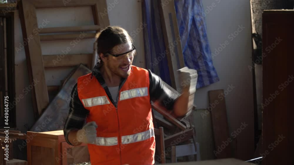 Happy and excited carpenter man celebrate to success with computer laptop with order and good news online . Business Owner wood worker In Workshop Happy and excited carpenter man celebrate to success with computer laptop with order and good news online . Business Owner wood worker In Workshop