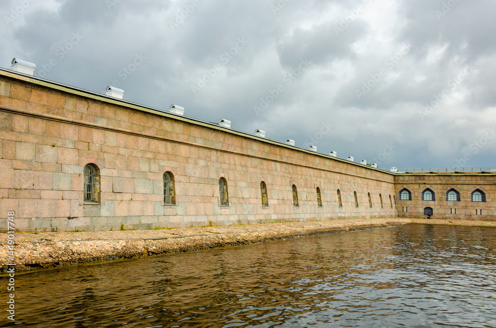 A long fortress wall running along the water.
