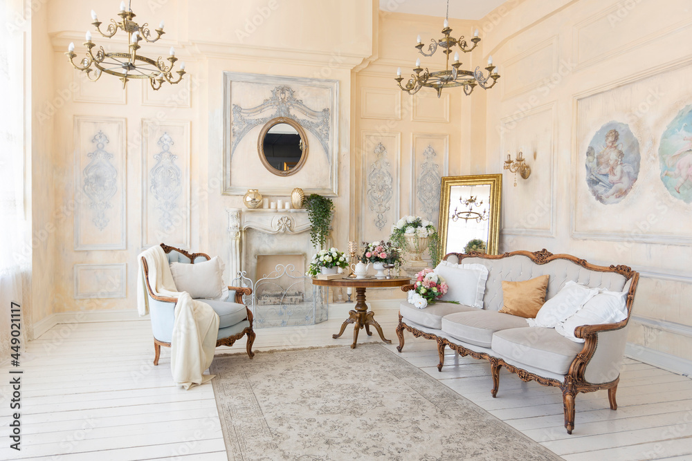 luluxury rich sitting room interior in beige pastel color with antique expensive furniture in baroque style. walls decorated with stucco and frescoes - obrazy, fototapety, plakaty 