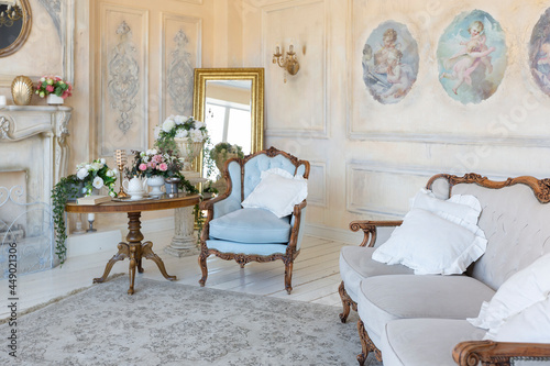 Obraz na plátně luluxury rich sitting room interior in beige pastel color with antique expensive furniture in baroque style