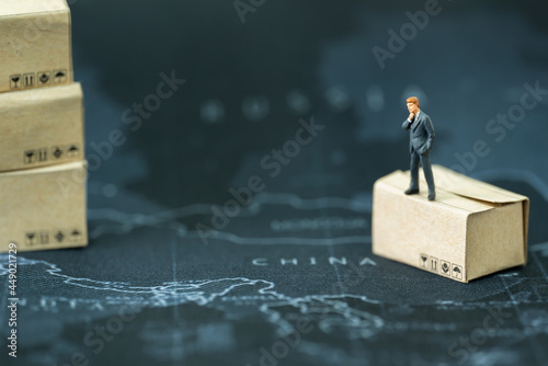 Photography Miniature businessman planning thinking success deal business on world china map