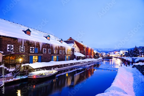 Otaru Canal in Winter. it is beautiful scene of Otaru canal with old warehouses. It is a popular tourist attraction of Hokkaido, Japan. photo