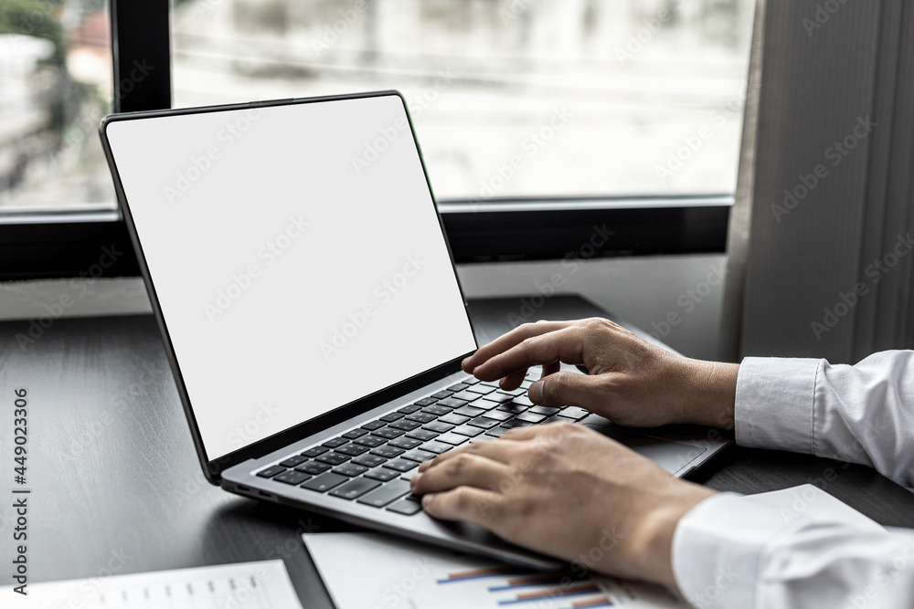 A business man typing on a laptop keyboard, he is using his laptop to type and text with colleagues to discuss his work together. Concept of using technology in communication. A business man typing on a laptop keyboard, he is using his laptop to type and text with colleagues to discuss his work together. Concept of using technology in communication.