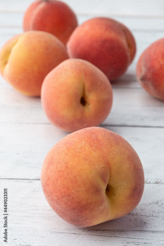 A group of peaches over wooden table A group of peaches over wooden table
