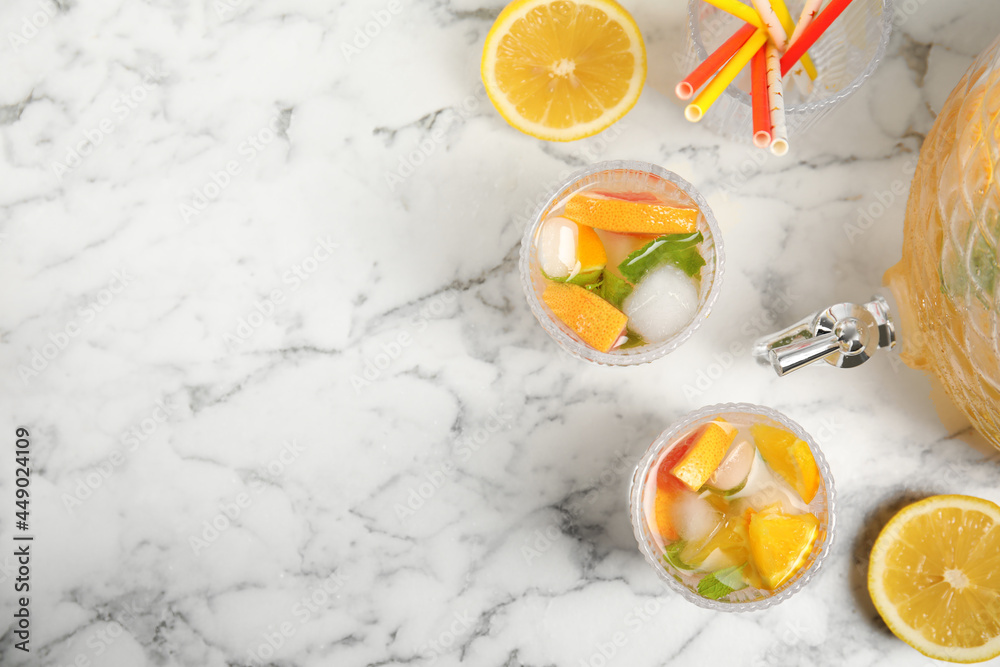 Delicious refreshing drink with orange and grapefruit on white marble table, flat lay. Space for text Delicious refreshing drink with orange and grapefruit on white marble table, flat lay. Space for text