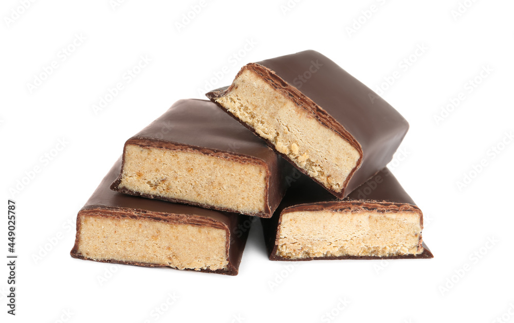 Halves of tasty chocolate glazed protein bar on white background