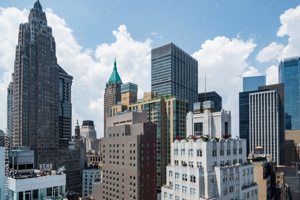 New York City lower Manhattan skyline view with skyscrapers and blue sky in the day.