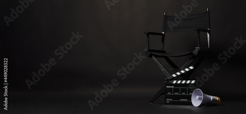 Canvastavla Black director chair and Clapper board or movie Clapperboard with megaphone on black background