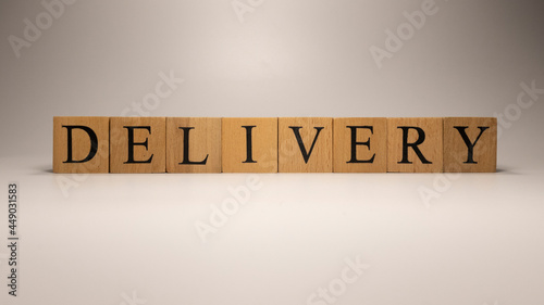 The name Delivery was created from wooden letter cubes. Economics and finance.
