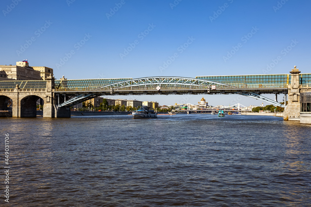 Beautiful city landscape, view of the Moscow River and the Pushkin (Andreevsky) pedestrian Bridge on a sunny summer evening - Moscow, Russia, July 2021