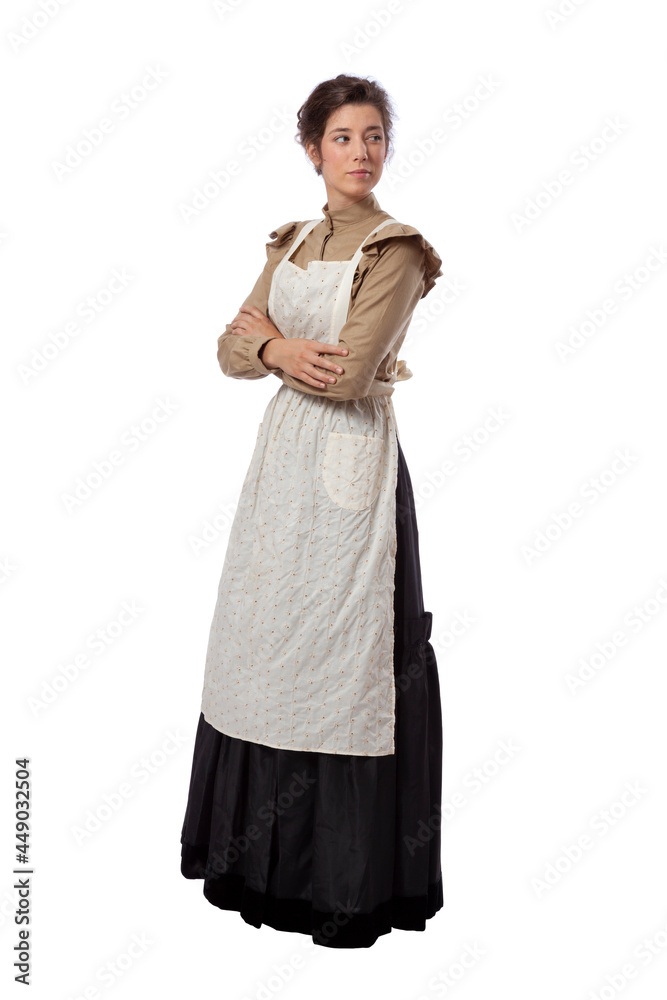 Young prairie woman wearing apron with arms folded isolated on white background Young prairie woman wearing apron with arms folded isolated on white background