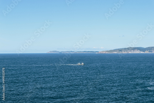 Blue view of fishermen boat returning in North sea from Spanish coast