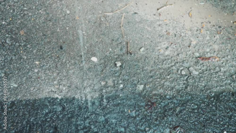 Rain falling on pavement. Concept weather and nature. Rain falling on pavement. Concept weather and nature.