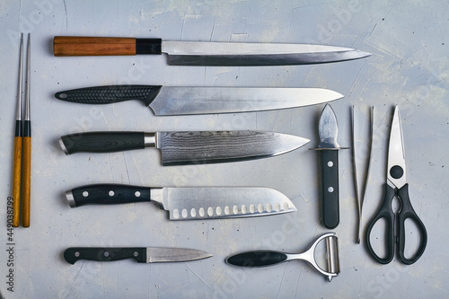 japanese knives on grey background top view photo