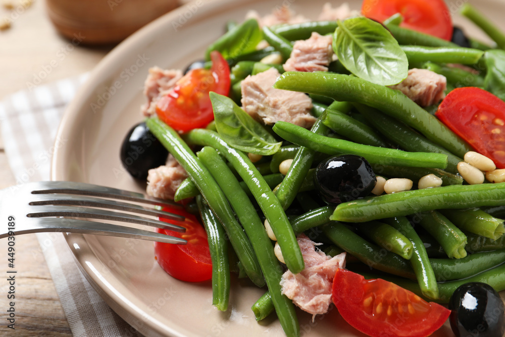 Tasty salad with green beans served on table, closeup