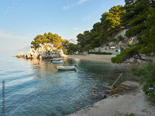 Paradise Beach Podrace surrounded by pine trees in the Croatian resort of Brela. Beautiful Adriatic Sea landscape.