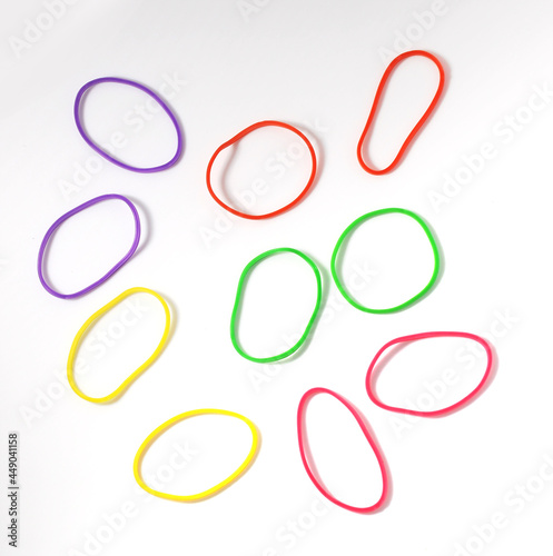 Group of multicolor rubber money bands isolated on white, round rubber band