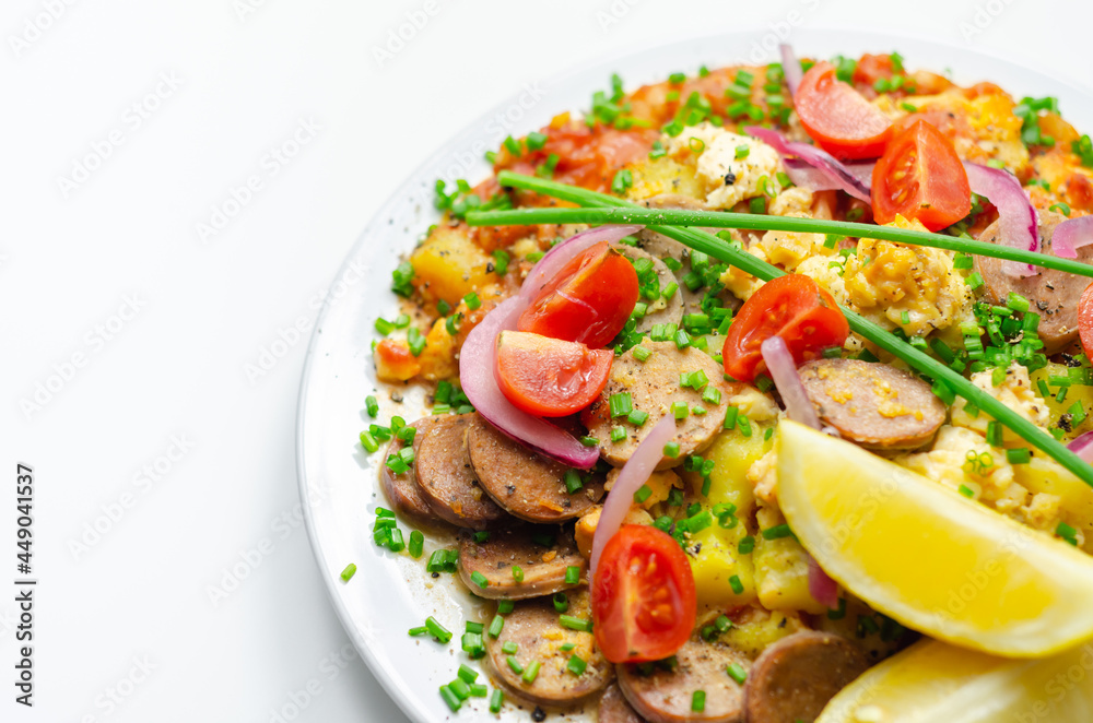 Haricot tomato bean sauce with turmeric potatoes, pork and herb sausage, and scrambled egg