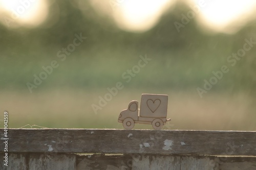 wooden muzzle of the supplier in raindrops at sunset, delivery of goods cute photo