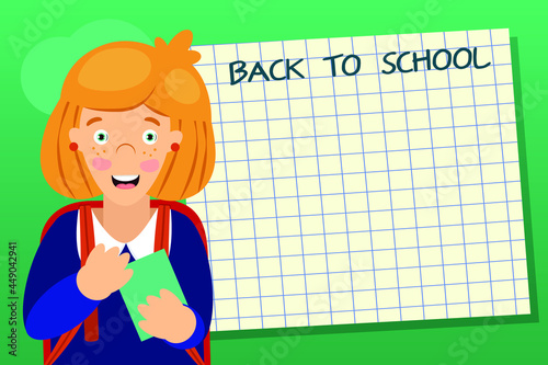 A first-grader child girl with a joyful smile with a red briefcase over her shoulders presses her notebook to her chest. Nearby is a white notebook sheet the inscription back to school