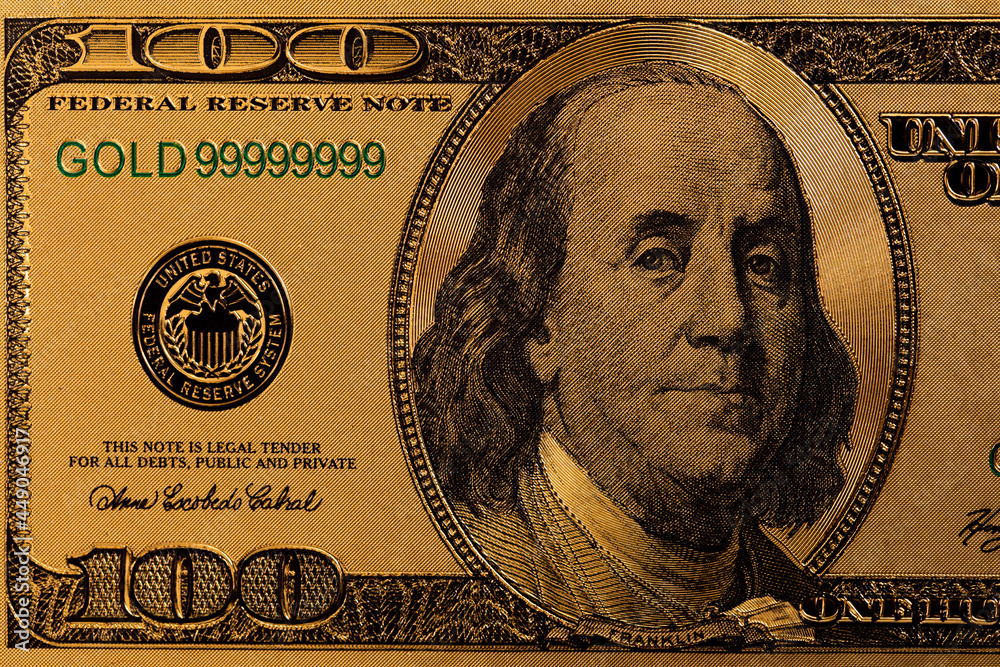 Fotografie golden 100 US dollar banknote
