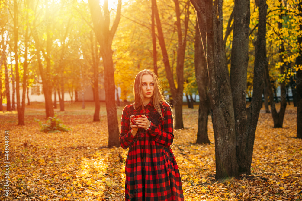 Vitamin D in autumn and winter season. Vitamin D in Womens Health, Role of Vitamin D3 Supplements in female health. Young woman enjoying sun in fall nature background
