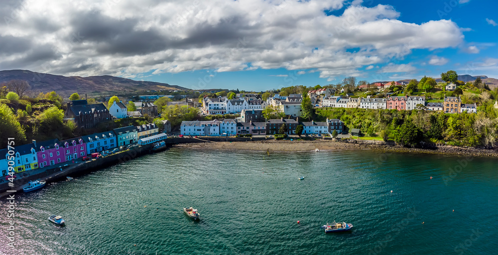 A panorama aerial view from offshore towards Portree on the Isle of Skye, Scotland on a summers day