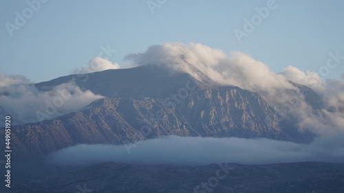 Lasithi Plateau mountain landscapes with cloudy sky on Crete Island in Greece. © Christopher