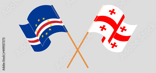 Crossed and waving flags of Cape Verde and Georgia