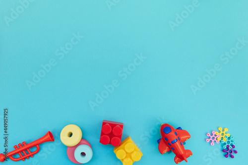 Background with plastic kids toys with copy space photo