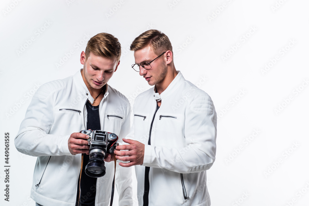 twin brothers men photographer in white casual look alike use vintage photo camera, photography. twin brothers men photographer in white casual look alike use vintage photo camera, photography.