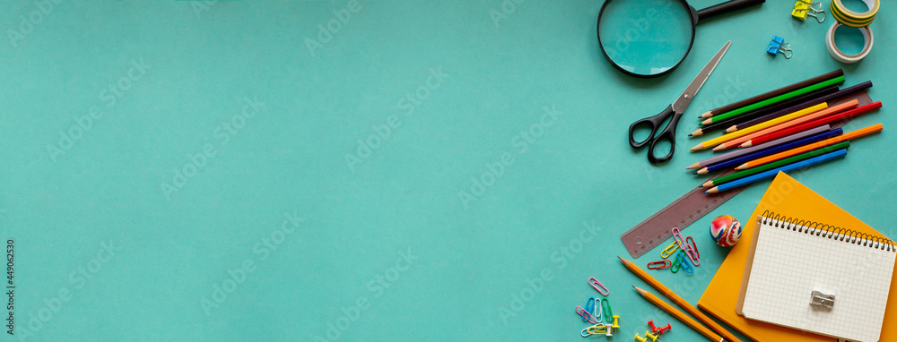 School supplies on a blue background. View from above. Copy space. School supplies on a blue background. View from above. Copy space.