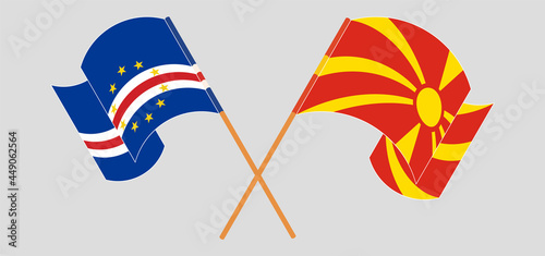 Crossed and waving flags of Cape Verde and North Macedonia