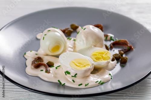 boiled eggs with mayo, anchovy fillets and capers