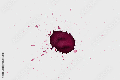 wine drop splash stain isolated on white photo