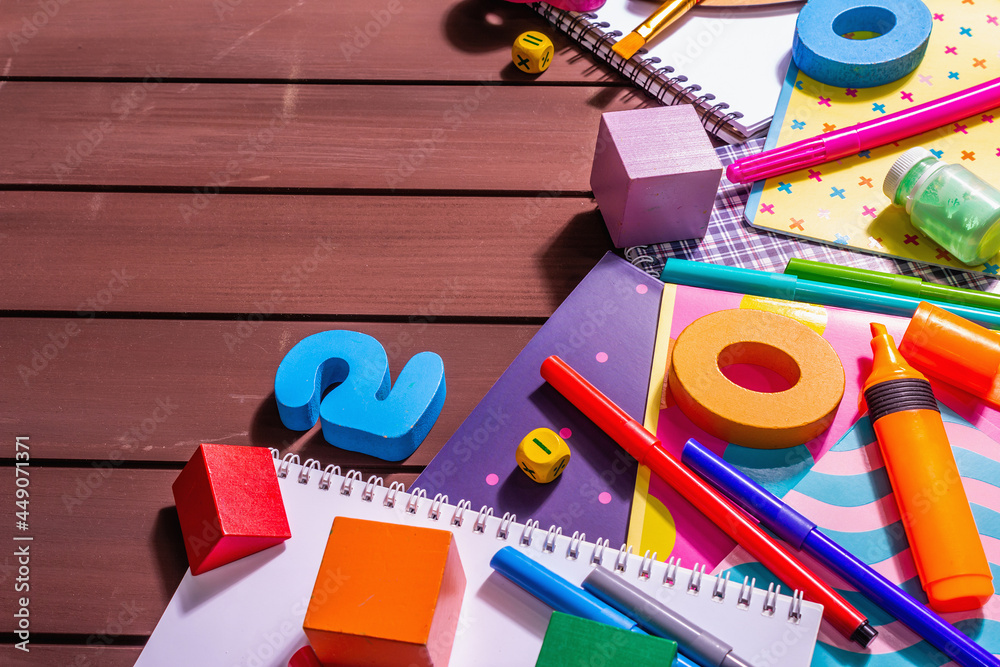 School supplies on wooden boards background School supplies on wooden boards background