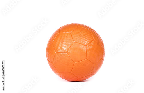 Orange futsal soccer ball with hexagon structure isolated on white background