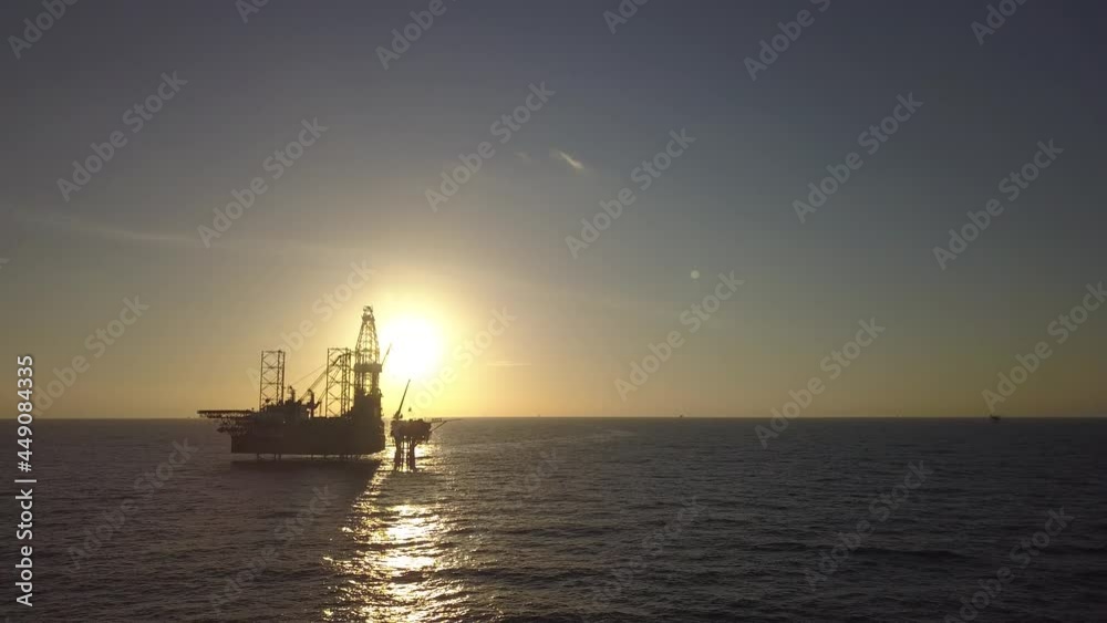Aerial view of the jack up rig shot during sunset time. Fly around the jack up rig with a drone.
Aerial view of the jack up rig shot during sunset time. Fly around the jack up rig with a drone.