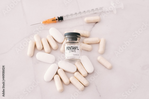 Fentanyl is a synthetic opioid narcotic used in medicine, vial isolated on white background.