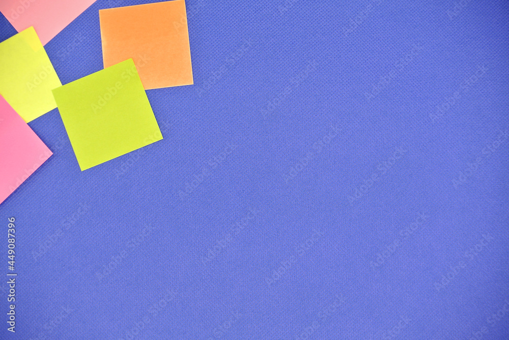 Paper note multiple color on blue background for copy space , message, information, text , advertisement , announcement and other. colorful paper note and space