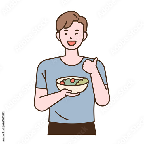 Vegetarian character. A man is holding a salad bowl and thumbs up. flat design style minimal vector illustration.