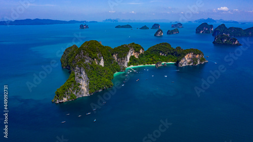 Aerial view of amazing tropical island, bay, Steep cliffs and Longtail boats