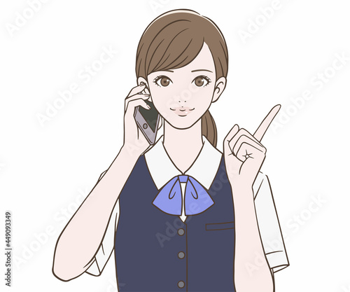 スマートフォンを持ち、人差し指を立てる事務員の女性
